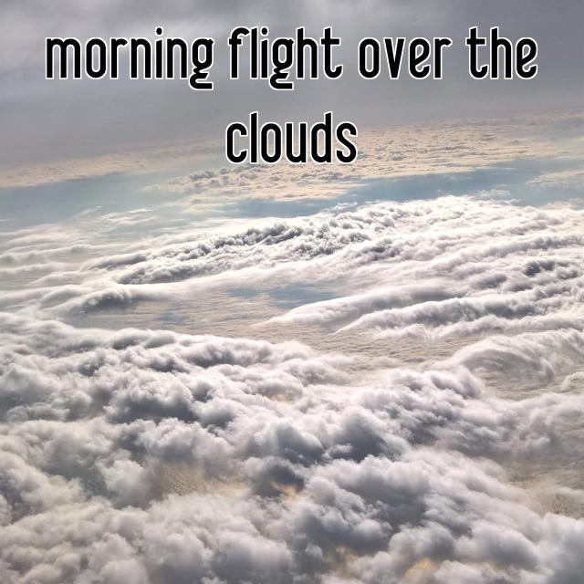 morning flight over the clouds